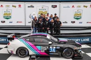 The team celebrates on Victory Lane